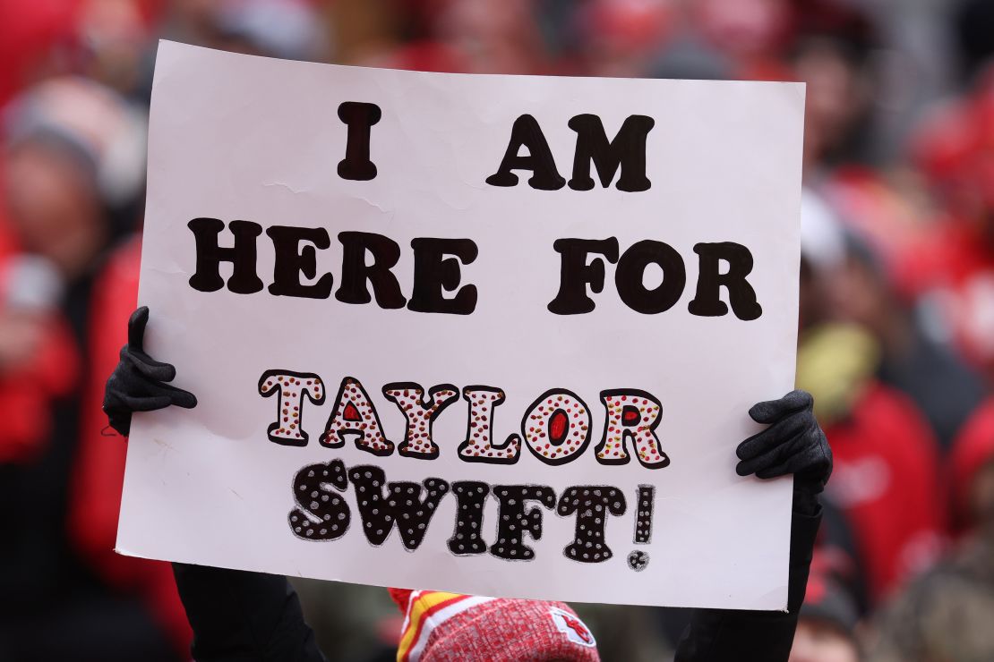 Fans display signs in support of Taylor Swift during the Raiders-Chiefs football game in Kansas City in December.