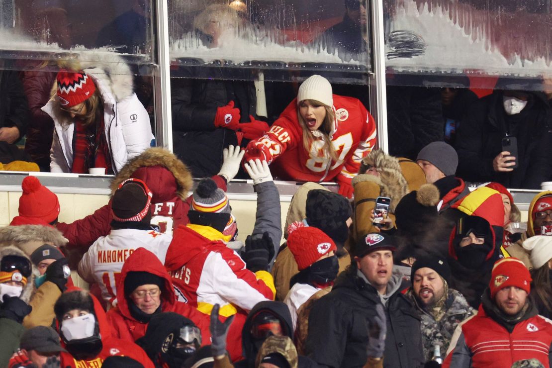 Taylor Swift celebrates with fans at the Dolphins-Chiefs football game in Kansas City in January.